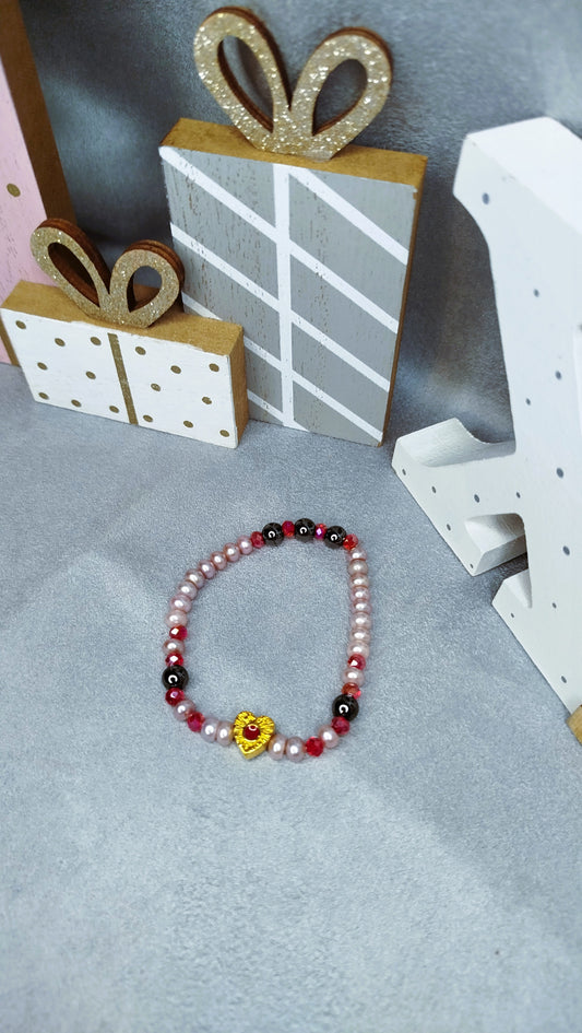 Bracelet Roja en hématite avec pendentif cœur émail rouge