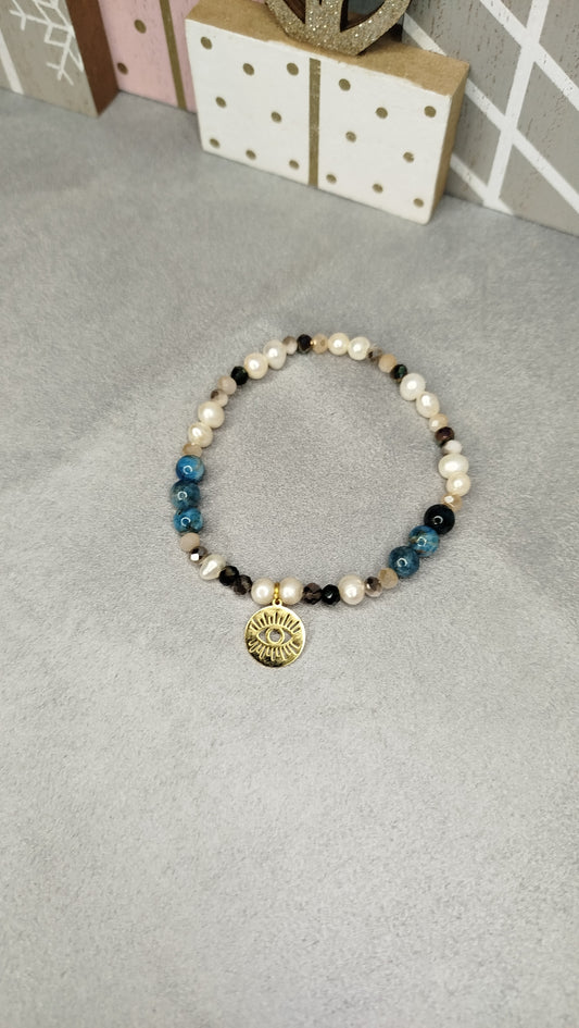 Bracelet Œil Malicieux – apatite bleue et pendentif œil ajouré dor
