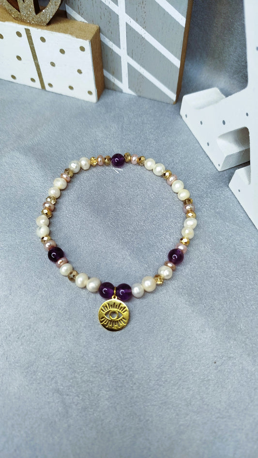 Bracelet Œil Scintillant – perles, améthyste et pendentif œil doré